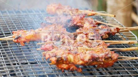 Close up of meat on grill with steam Stock Photos