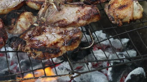 Close up of Meat on an Open Fire Stock Footage 42684599