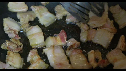Close-up of Meat Sizzling in Hot Pan Stock Footage 330707584