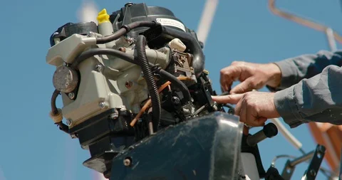 Close-up of a mechanic hand repairing a motor boat Stock Footage 89123789