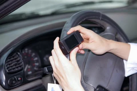 Close up of mechanic man use mobile phone aplication to check the motor function Stock Photos
