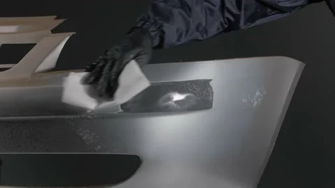 Close-up of a mechanic preparing a car body for painting Video stock 202169282