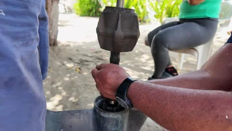 Close-up mechanic repairing lower unit of an outboard motor. Outdoor Manual work Stock Footage 341454993