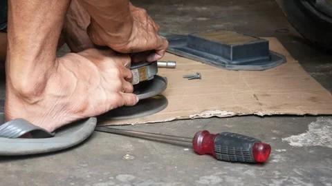 Close up of a mechanic repairing or maintaining a motorcycle CVT Stock Footage 304723247