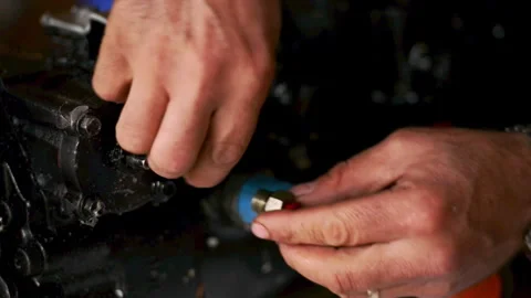 Close-up of Mechanic Servicing Aircraft Engine Component Stock Footage 331745632