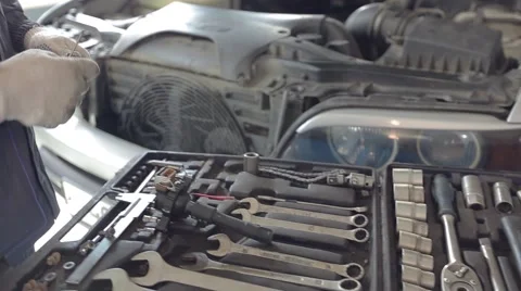 Close-up of Mechanic Taking Tools for Fixing Car Stock Footage 62166316