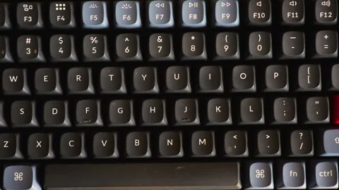 Close-up of Mechanical Keyboard with Red Enter Key. High-angle macro shot o.. 스톡 동영상 330424923