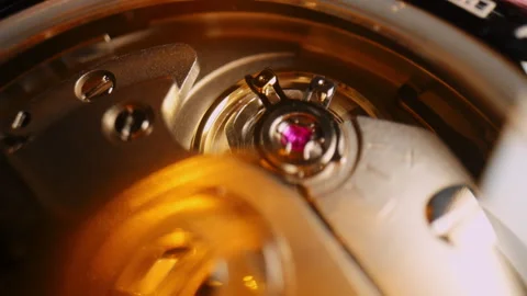 Close-up of mechanical watch movement showing balance wheel and ruby j Stock Footage 326183929