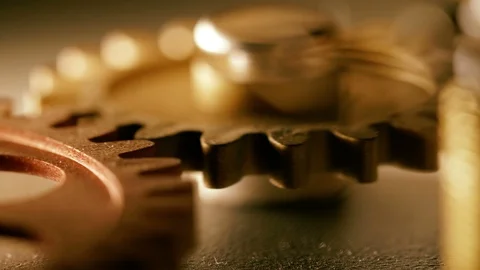 Close up on mechanical wheels rolling slowly. time passing Stock Footage 90024761