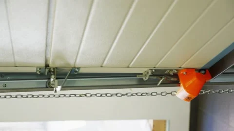 A close-up of the mechanism that opens and closes an automatic garage door. Stock Footage 343532662