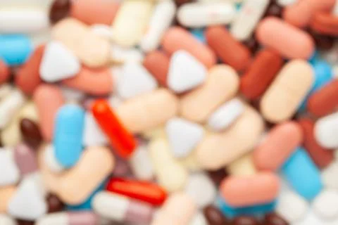 Close up of medicinal or herbal multi-color tablet, capsule, and pill on the  Stock Photos