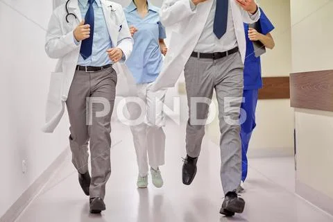 Close up of medics or doctors running at hospital Stock Photos