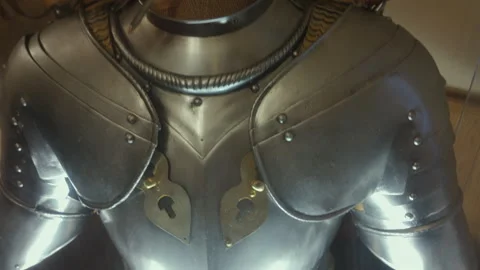Close-up of medieval armor helmet with red feather plume on display in muse.. Stock Footage 314375796