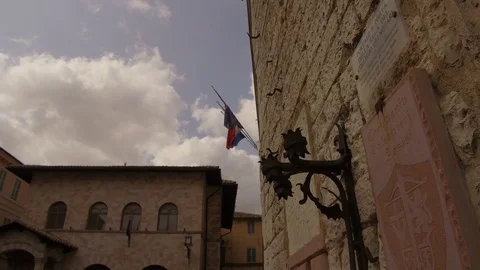 Close up medieval flag bearer in central Assisi Stock Footage 82112673