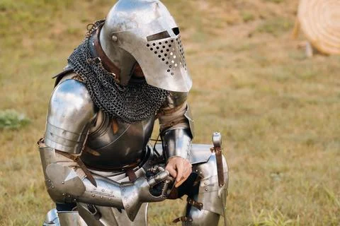 Close-up of a medieval knight in armor preparing for battle Stock Photos