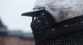 Close-up of medieval knight wearing steel helmet with chain mail face mask HD Footage