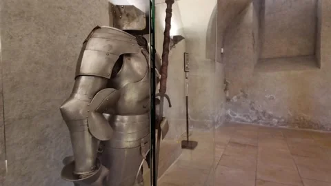 A close-up of a medieval knight's armor with a two-handed sword next to it - Stock Footage 314107413