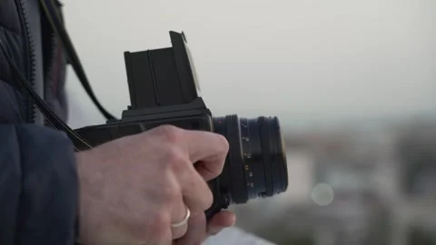 Close up of medium format film photo camera in male hands Stock Footage 240203674