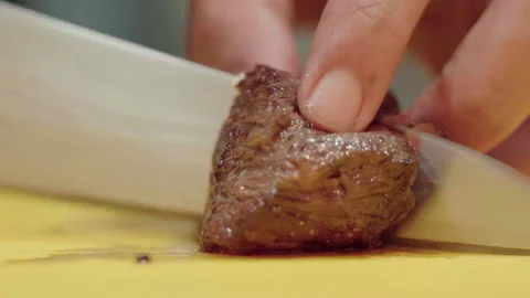 Close up Medium rare Grilled beef slicing slowmotion 50fps Video stock 156172377