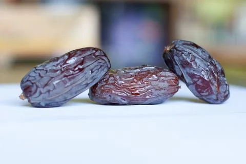 Close up of medjool dates on chopping board Stock Photos