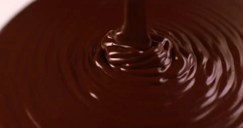 Close up melted hot chocolate liquid pouring in slow motion. Stock Footage 163046006