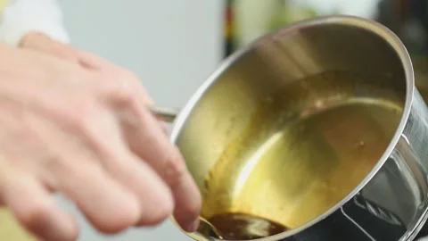 Close-up, melted sugar in the pot. Making of hot caramel for dessert. Stock Footage 171186238