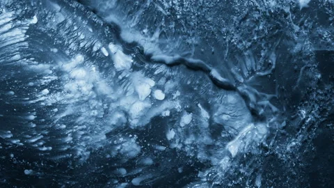 Close-up of melting ice on black background Vídeo Stock 111174373