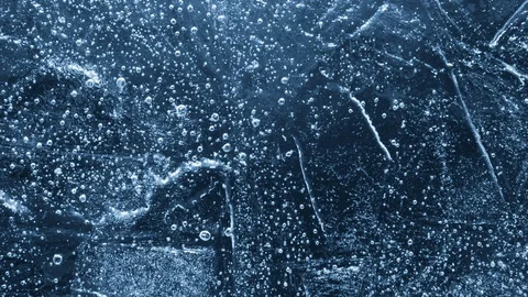Close-up of melting ice on black background 스톡 동영상 125576877