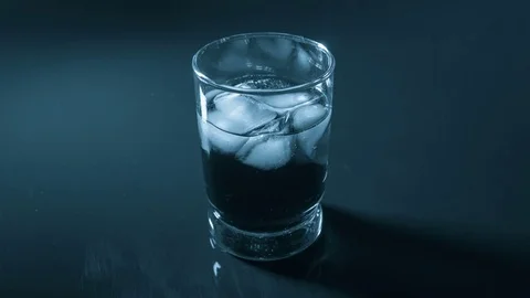Close-up of melting ice cube in whiskey glass 動画素材 80981864