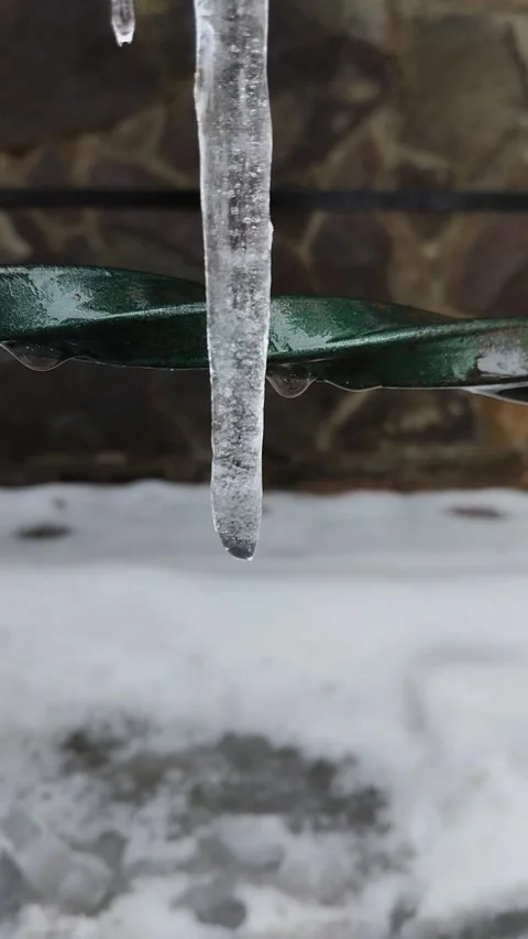 Close-up of a melting ice icicle. Stock Footage 332509579