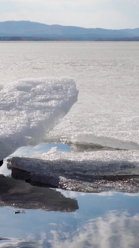 Close-up of melting spring ice on the lake shore. Stock Footage 293138267