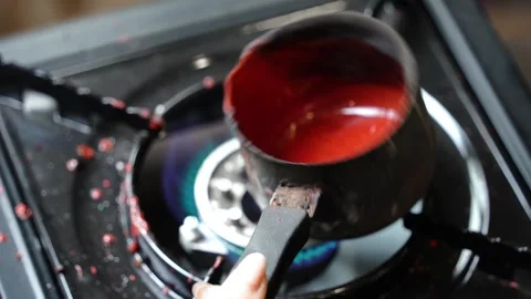 Close-Up Melting Wax in Small Pot on Gas Stove for Wax Seal Stock Footage 315529305