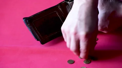 Close-up men count money , empty pocket on red Stock Footage 168071242