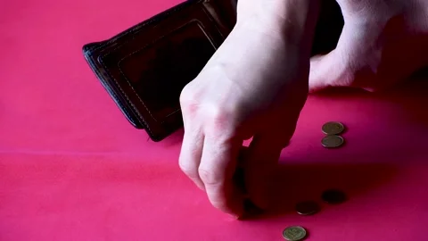Close-up men count money , empty pocket on red. Ukrainian money ,kopiikas Stock Footage 168071296