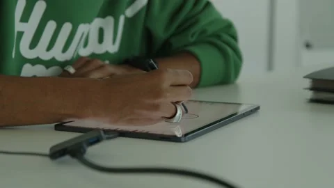 Close-up Men drawing with pen on tablet Stock Footage 169073225