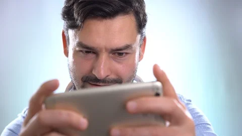 Close up of men hands holding touching play game mobile phone Stock Footage 101633797