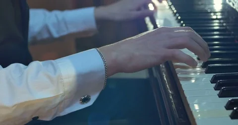 Close up of men hands playing on piano Stock Footage 75779594