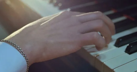 Close up of men hands playing on piano Stock Footage 75779635