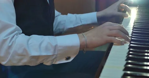 Close up of men hands playing on piano Stock Footage 75779686