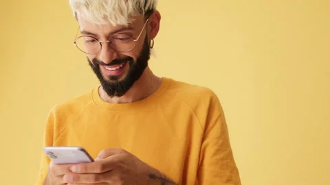Close-up, men laughs reading sms, watching video on mobile phone, isolated on Stock Footage 253935049