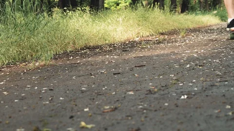 Close up of men legs start ride on board in the summer park. Skater boy ride  Stock Footage 110705311