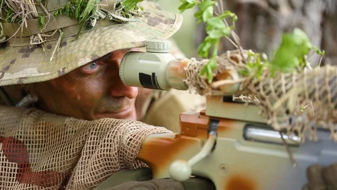 Close-up. Men looking through the sniper scope and rifle reloads and shoots. Stock Footage 127648566