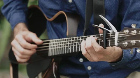 Close-up of men playing guitar Stock Footage 233871792