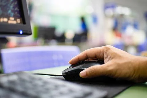 Close up a men working with computers on the glass table in the office Man'.. Stock Photos