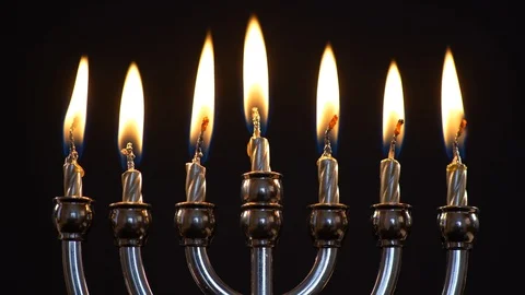 Close up of Menorah With All Candles Burning on Black Background Stock Footage 130165663