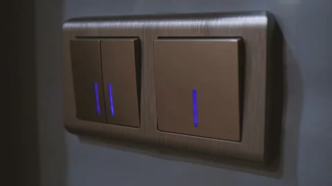 Close up men's hand flips a light switch on and off Video stock 140759439