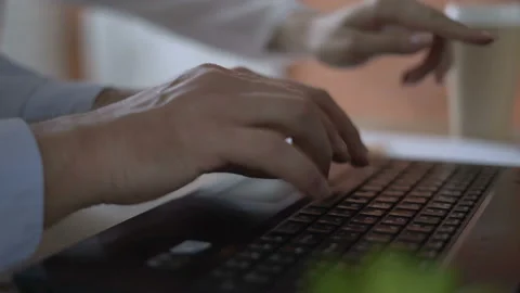 Close-up. men's hands actively and quickly type on the keyboard of the laptop Stock Footage 112757068