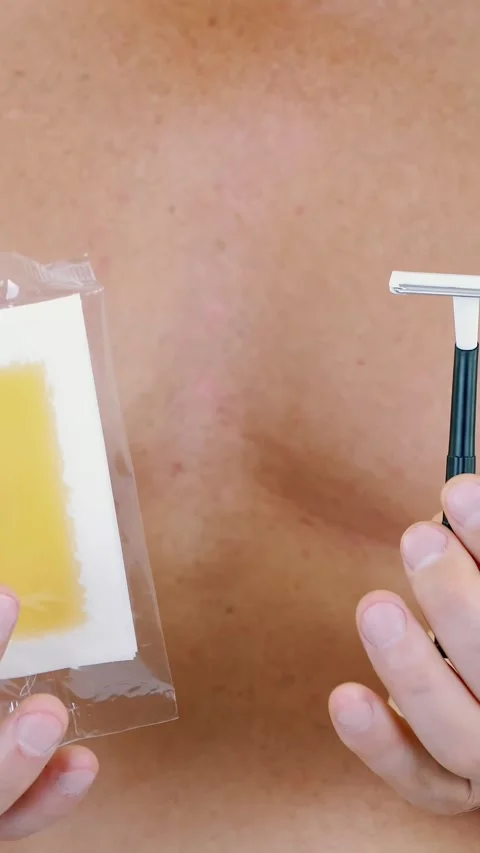 Close-up, Men's hands hold stripes with wax and a razor, different means for Stock Footage 308804605