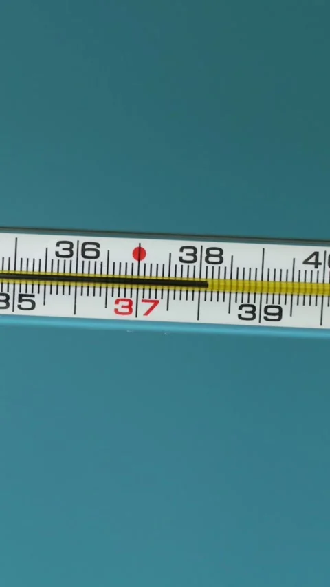 Close-up of a mercury thermometer showing temperature readings Stockbeeldmateriaal 343838112