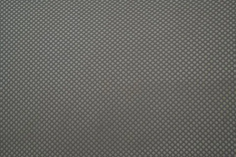Close up of the mesh fabric pattern from the backrest of the chair. Stock Photos